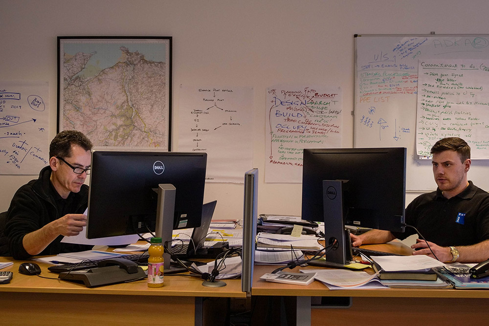 Two engineers working at their desks