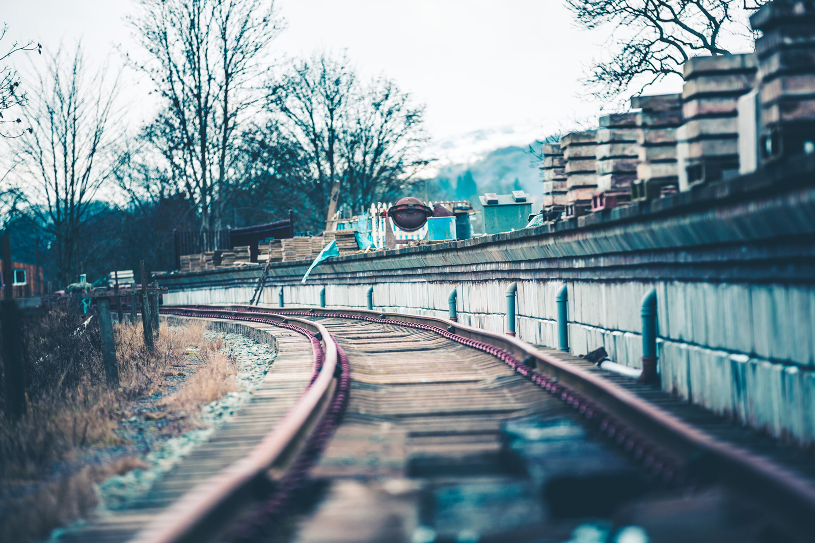 Llangollen Railway track with construction materials on train platform.